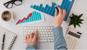 Digital marketer reviewing analytics showing increase in organic website traffic.